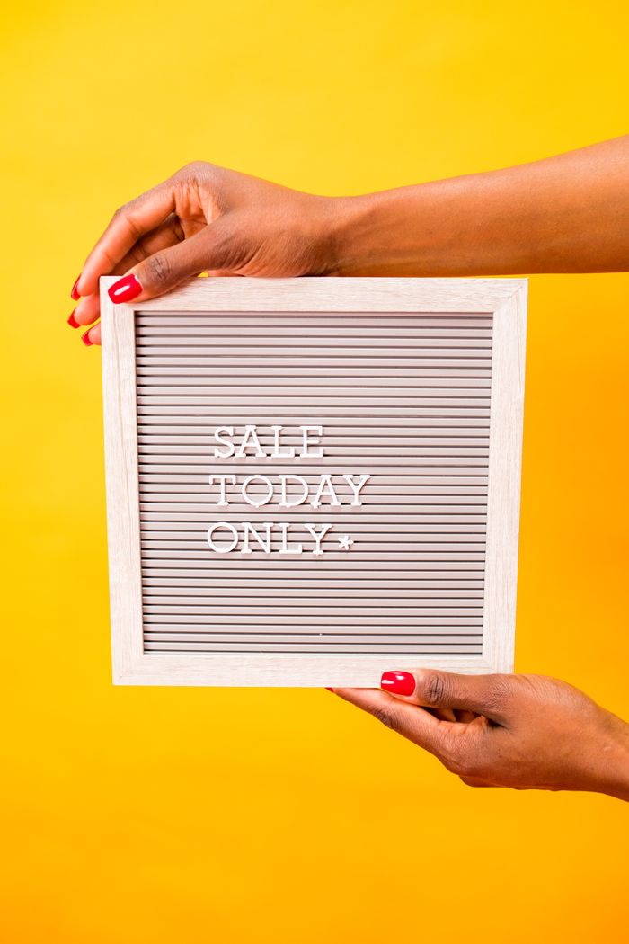 about-hero Square letter board with 'SALE TODAY ONLY' held by hands against a vibrant yellow background.